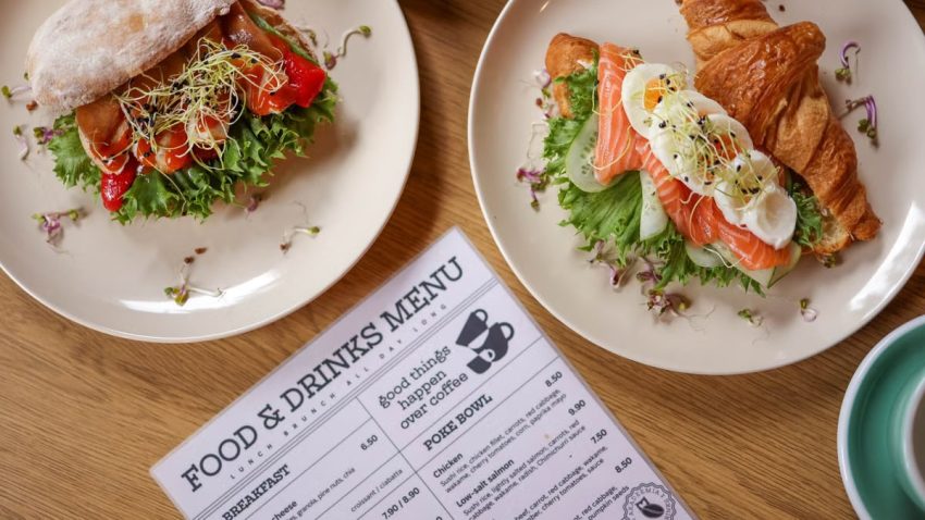 Tasty croissant sandwich with salmon and ciabatta with vegetables, perfect for a balanced meal.